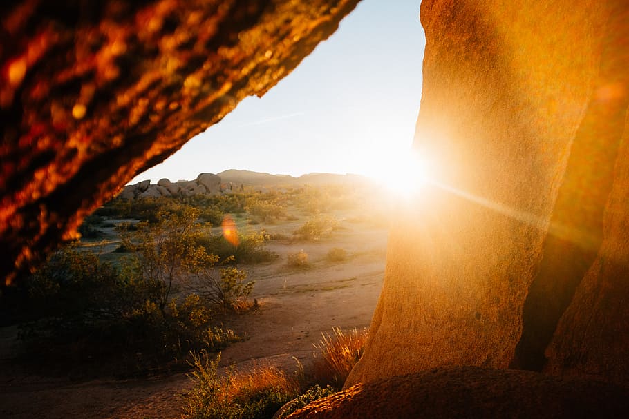 brown rock formation during golden hour, stone, sunlight, flare HD wallpaper