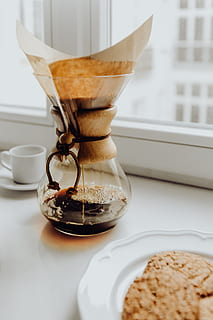 Brewign third wave coffee with chemex glass and drip kettle for pure flavor  in good design on wooden table Stock Photo - Alamy