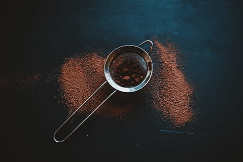 round grey metal filter with brown powder on black surface, cacao HD wallpaper