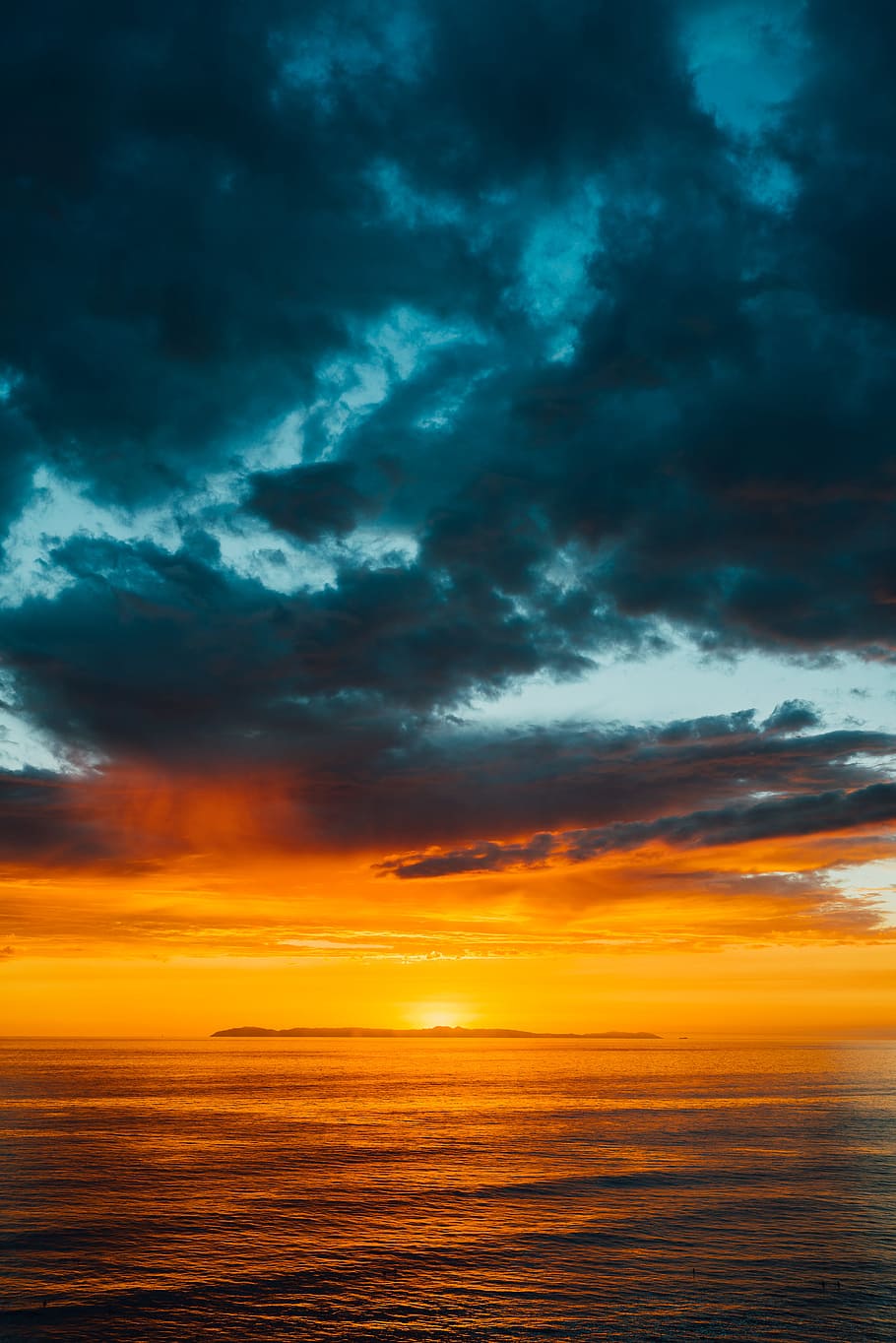 green and black clouds partly covering orange sky over sea at sunset, HD wallpaper