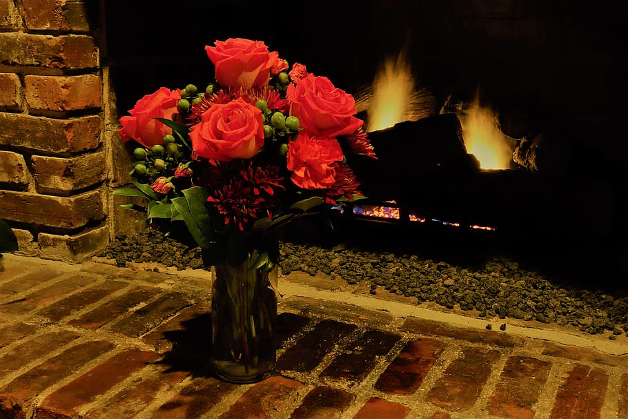 roses, fireplace, bricks, green, flames, red, mood, warm, romantic HD wallpaper
