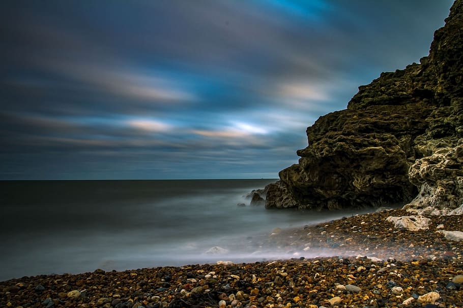 Time-lapse Photo of Body of Water and Rock, beach, blue, clouds HD wallpaper