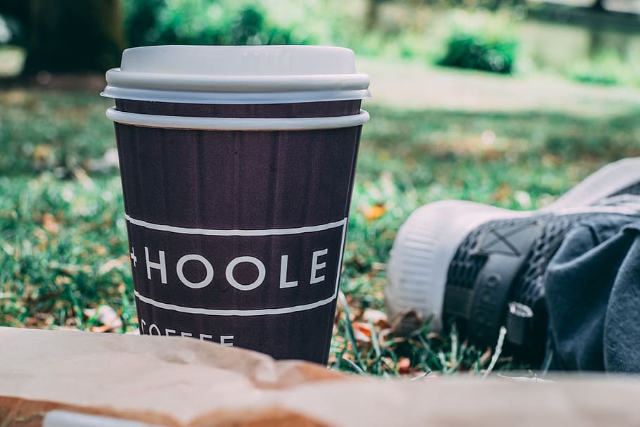 Black and White Coffee Cup on Green Grass, beverage, blurred background HD wallpaper