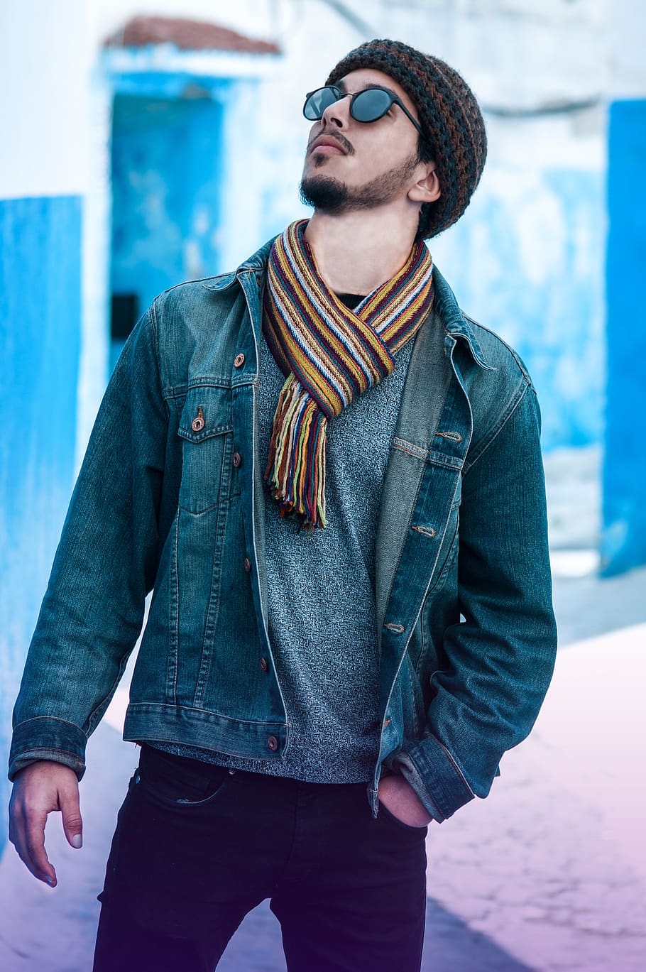 selective focus photography of man wearing blue denim jacket