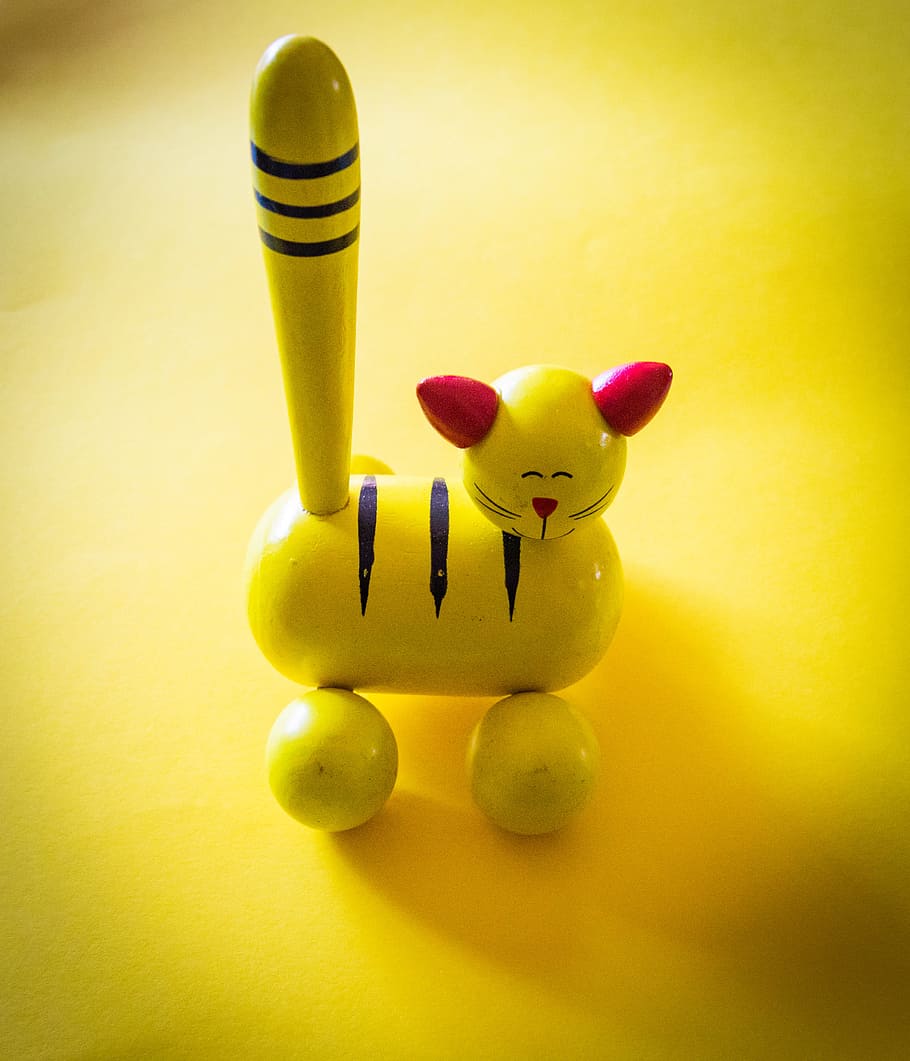 Yellow and Red Cat Figurine on Yellow Top, blur, colours, conceptual, HD wallpaper