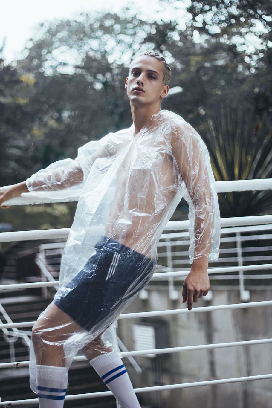 Man Holding Rail While Wearing Plastic Dress, active, attractive HD wallpaper