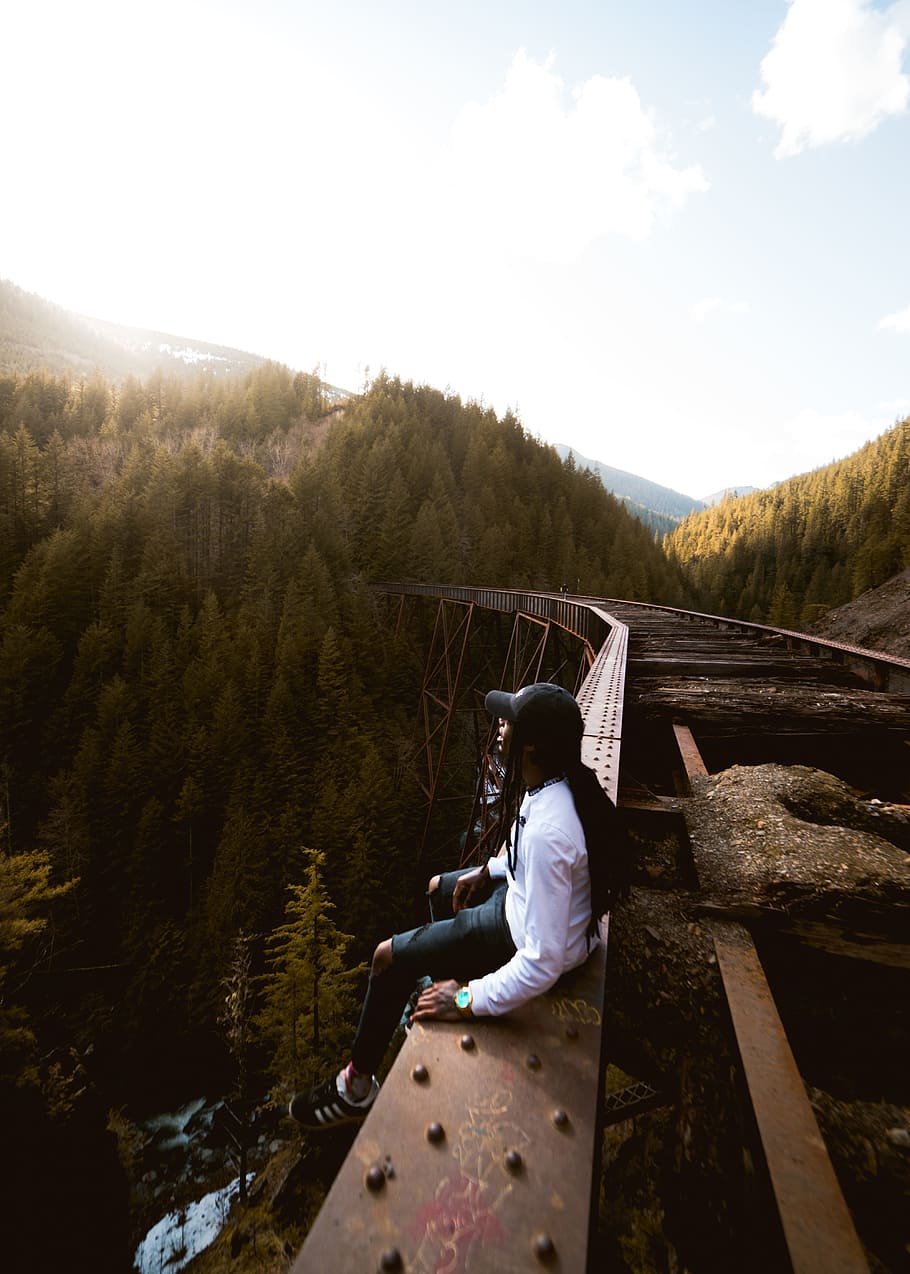 person, bridge, forest, mountain, tree, sunlight, glow, nature HD wallpaper