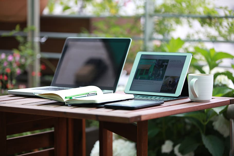 Two Black Laptop Computers Turned on, cup, desk, digital nomad HD wallpaper