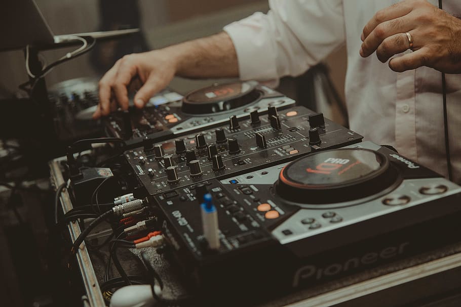 man operating DJ controller, one person, music, hand, real people HD wallpaper