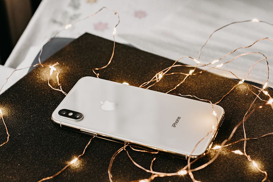 Close-Up Photo of iPhone Near String Lights, camera, cellphone HD wallpaper