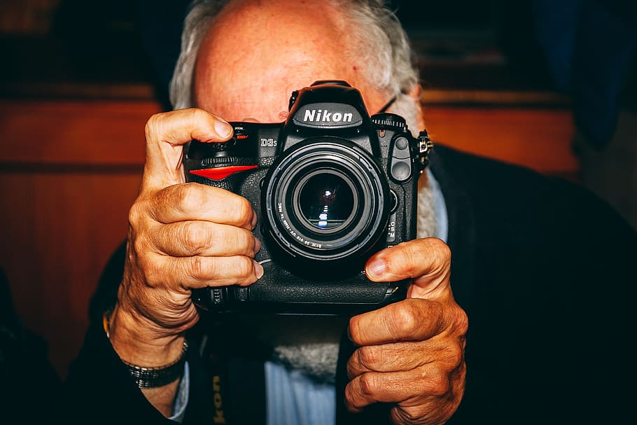 man holding black Nikon camera, camera - photographic equipment HD wallpaper
