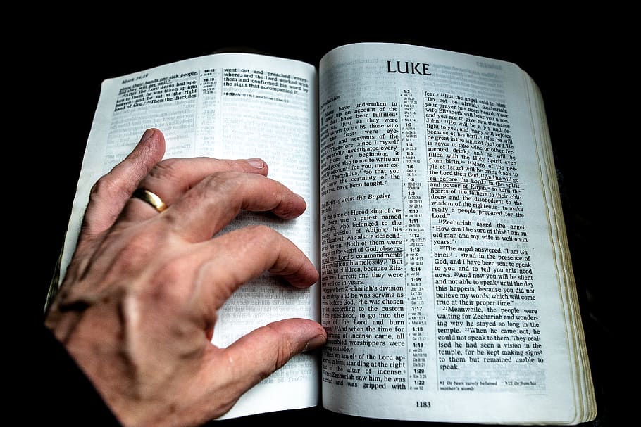 Luke book page, human hand, human body part, black background HD wallpaper