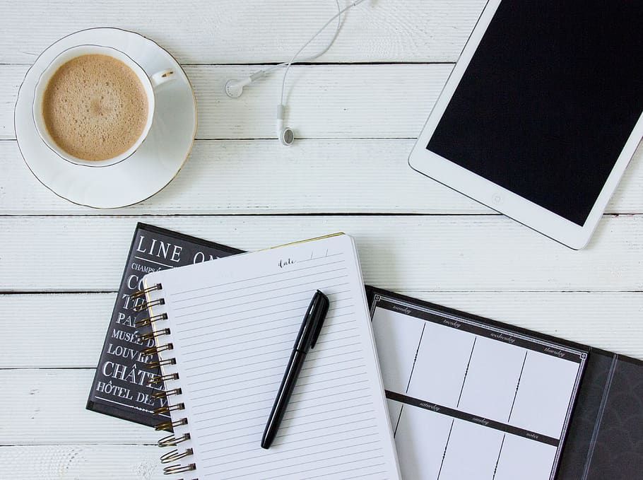 Black Pen on White Writing Spring Notebook Between White Ipad and White Ceramic Mug With Latte on White Plate HD wallpaper