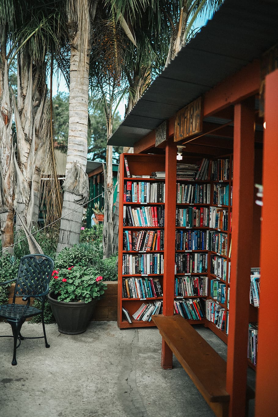 books on library shelving, shelf, publication, chair, bookshelf HD wallpaper
