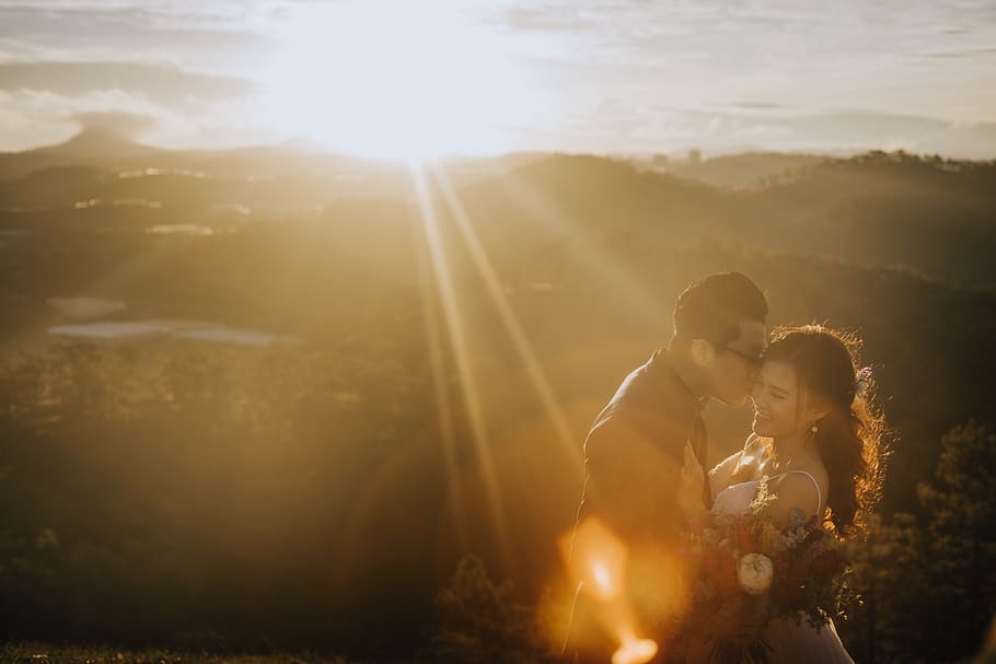 Man Kissing Woman's Cheek, backlit, blur, clouds, couple, dawn HD wallpaper