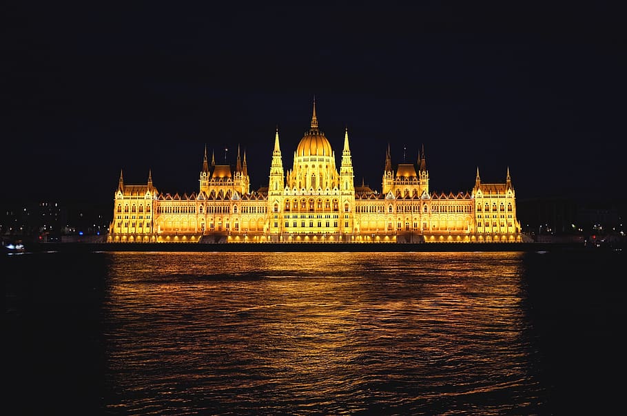 Yellow Castle Near Body of Water at Night Time, architecture HD wallpaper
