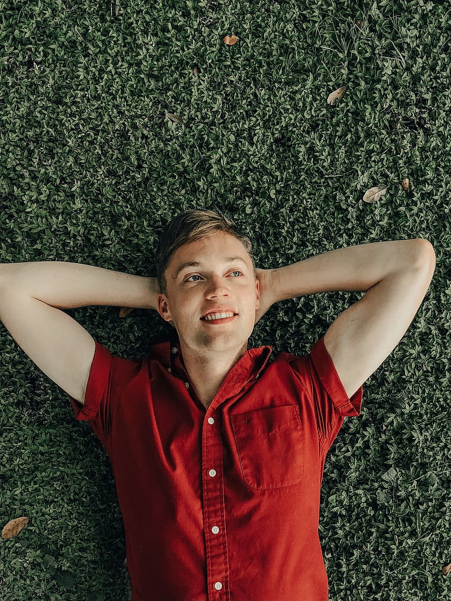 smiling man laying on green grass, person, greenery, portrait HD wallpaper