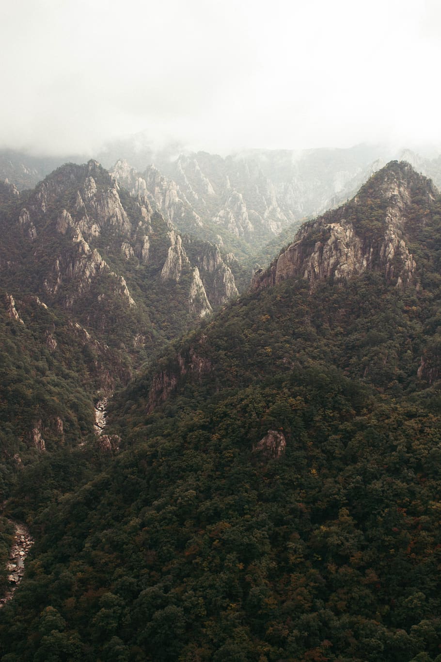 a mountain on top of the earth and a ray of mysterious light passing though  the mountain vertically