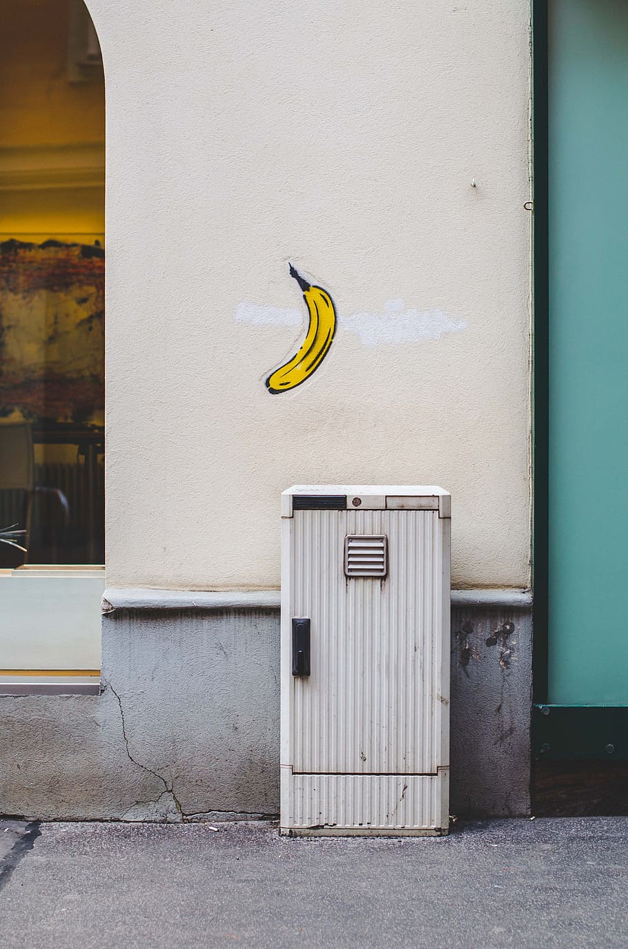 white mailbox near wall with banana fruit painting, plant, food