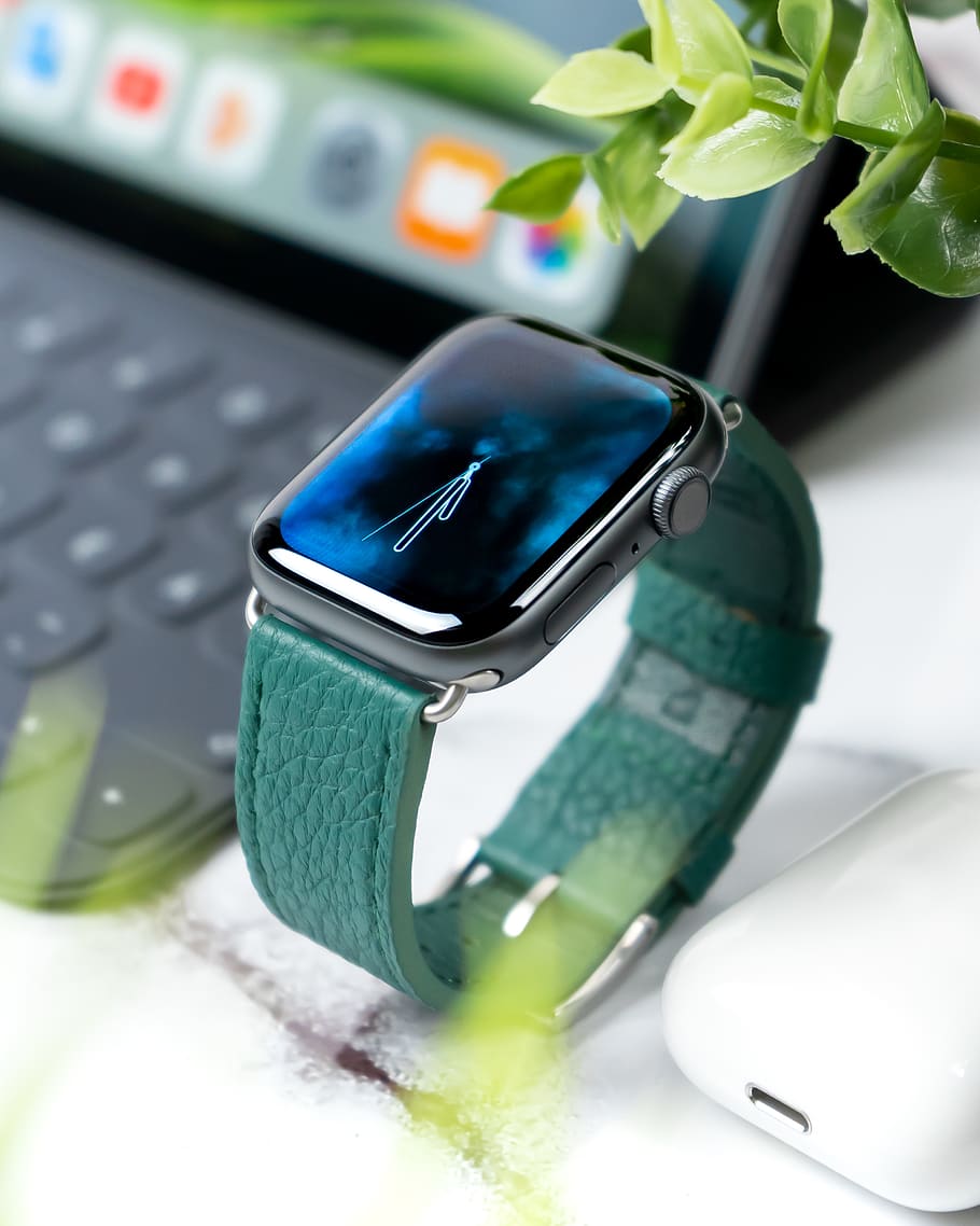 Apple Watch with green band, indoors, technology, close-up, wireless technology
