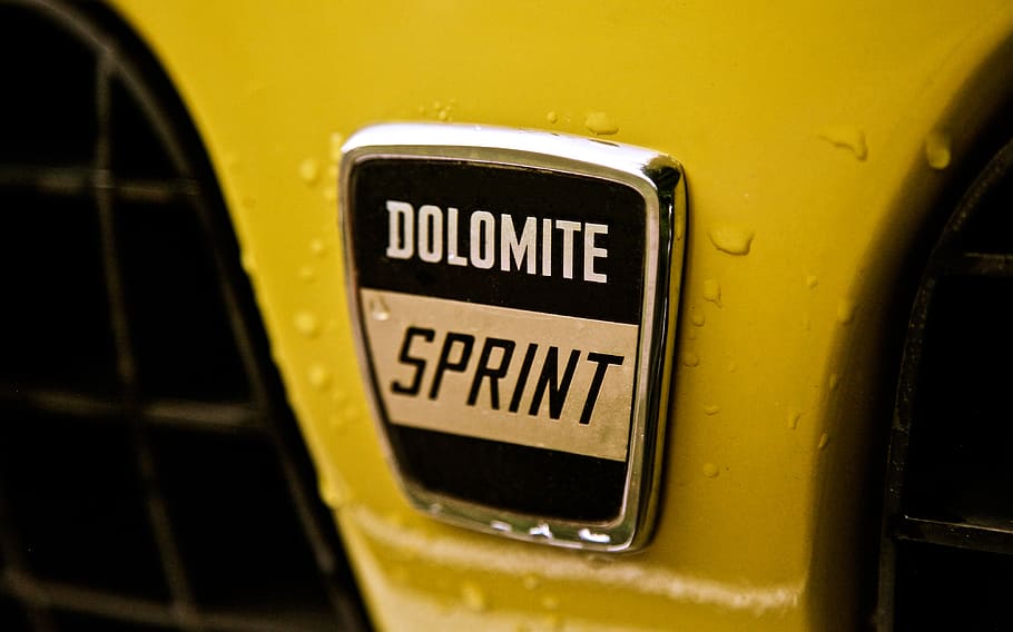 Dolomite Sprint emblem, yellow, text, western script, mode of transportation HD wallpaper