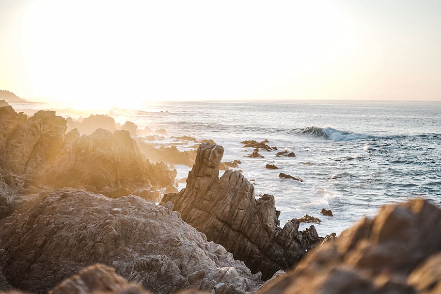 brown rock fragments near body of water, sandstone, sun, sunset HD wallpaper