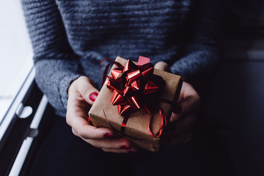 person holding present box, gift, human, finger, plectrum, fire, HD wallpaper