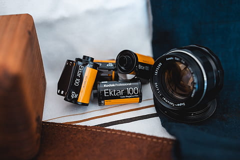 black webcam and Ektar 100 films on white textile, texture, blue HD wallpaper