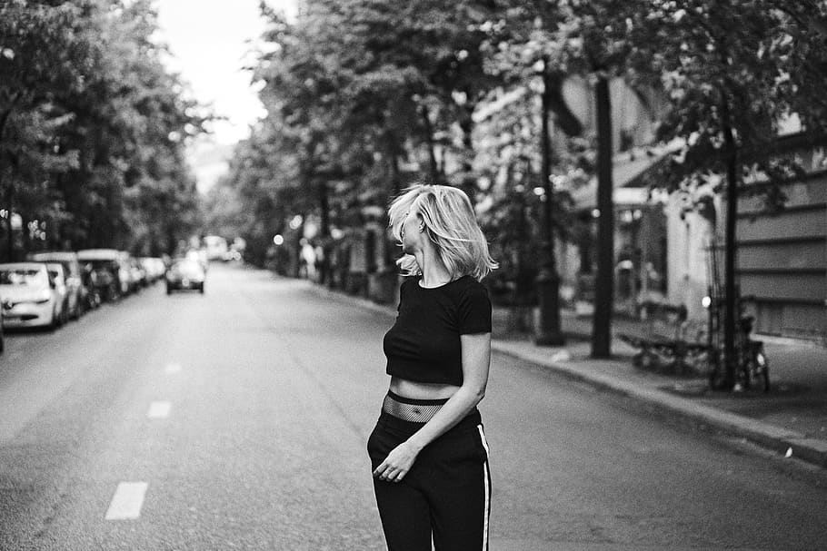 grayscale photo of woman leaning back standing on street, one person, HD wallpaper