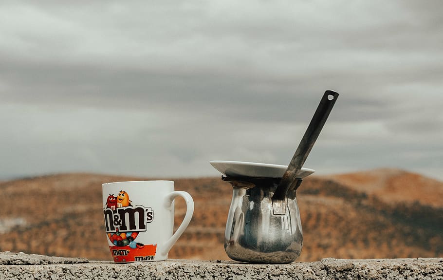Multicolored M&m's Ceramic Cup Beside Gray Stainless Steel Cezve Pot HD wallpaper