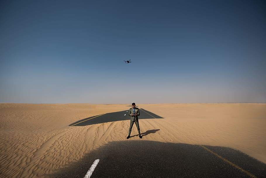 Man Standing in the Middle of Desert Place, alone, arid, barren
