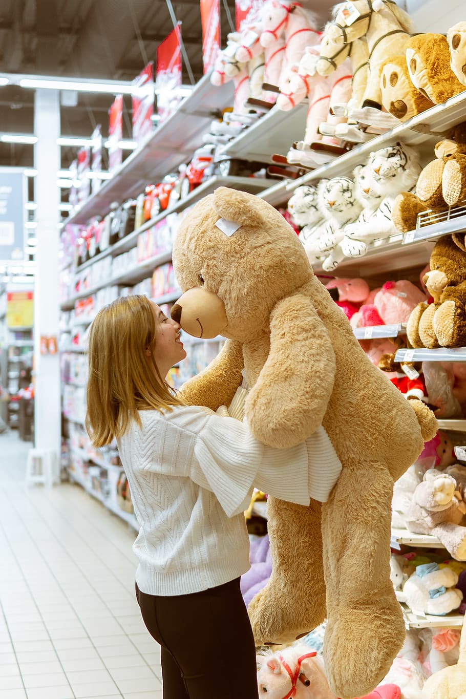 Adults carrying stuffed sales animals