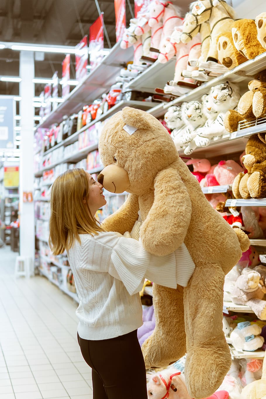HD wallpaper: woman carrying life size bear plush toy, shop, teddy ...
