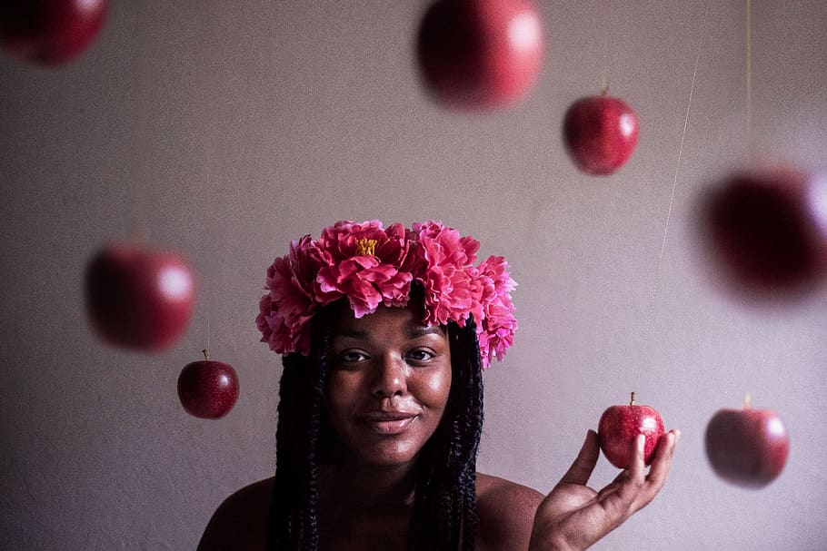 selective focus photography of woman wearing flower headband holding apple fruit, HD wallpaper
