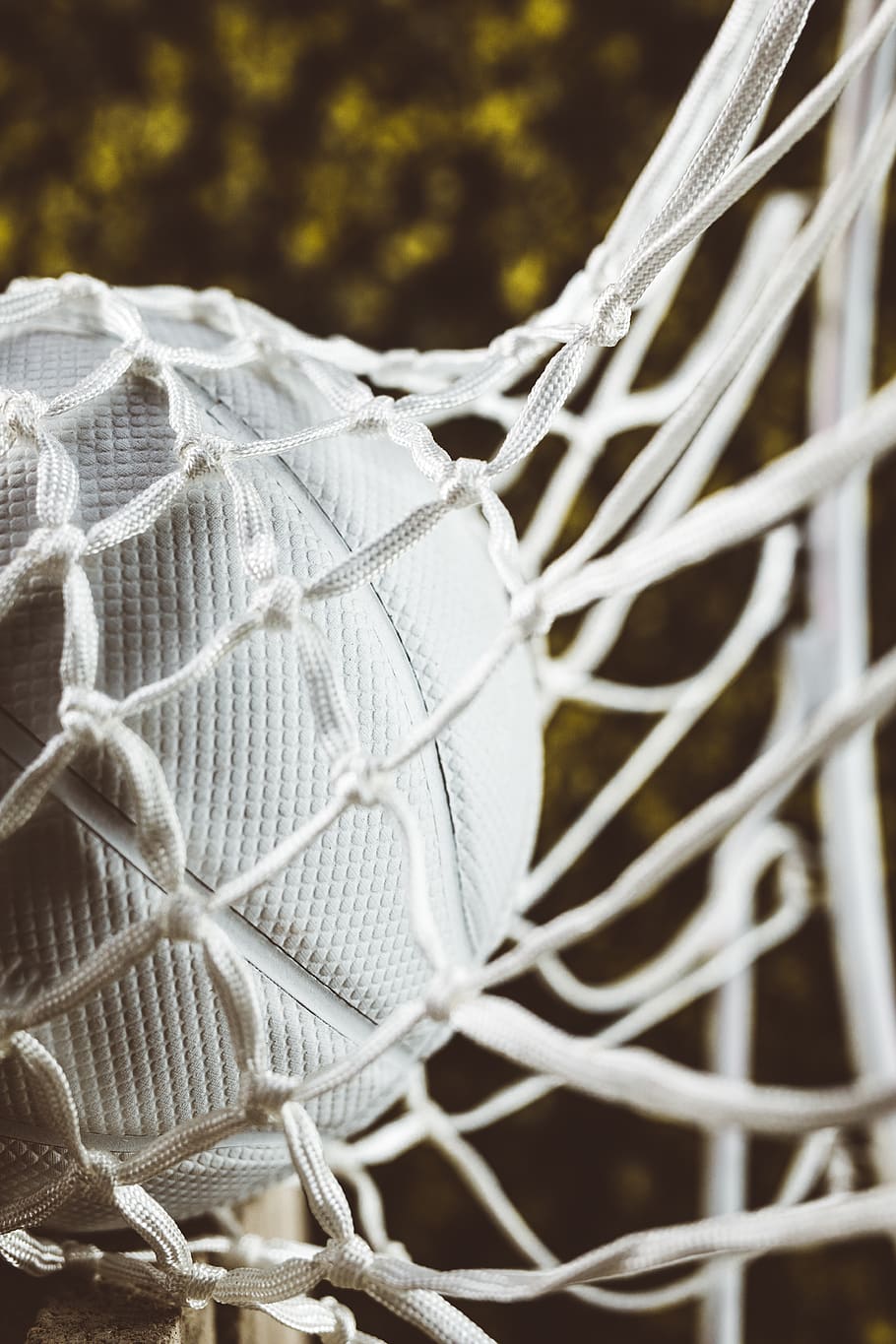 white ball in net in close-up photo, furniture, sports, team sport