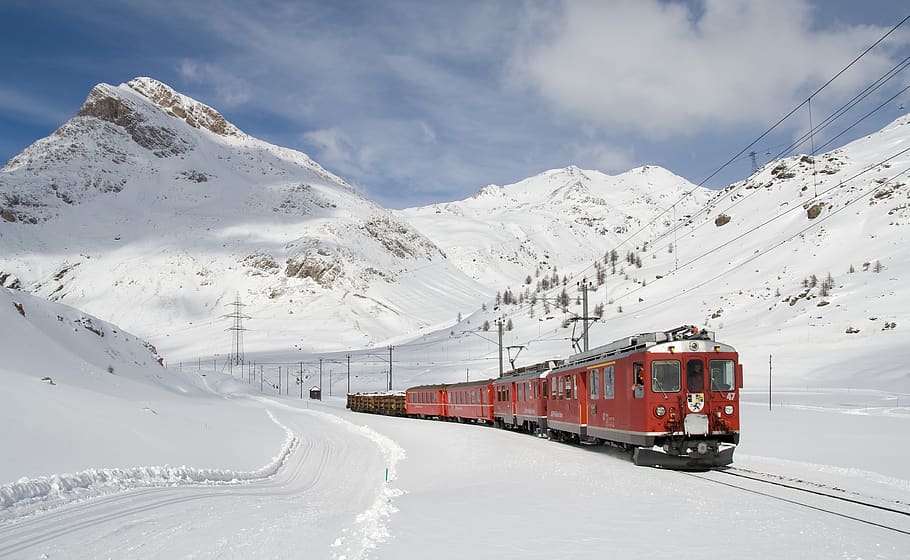 Red and Black Train Running Along Snow Covered Field, clouds HD wallpaper