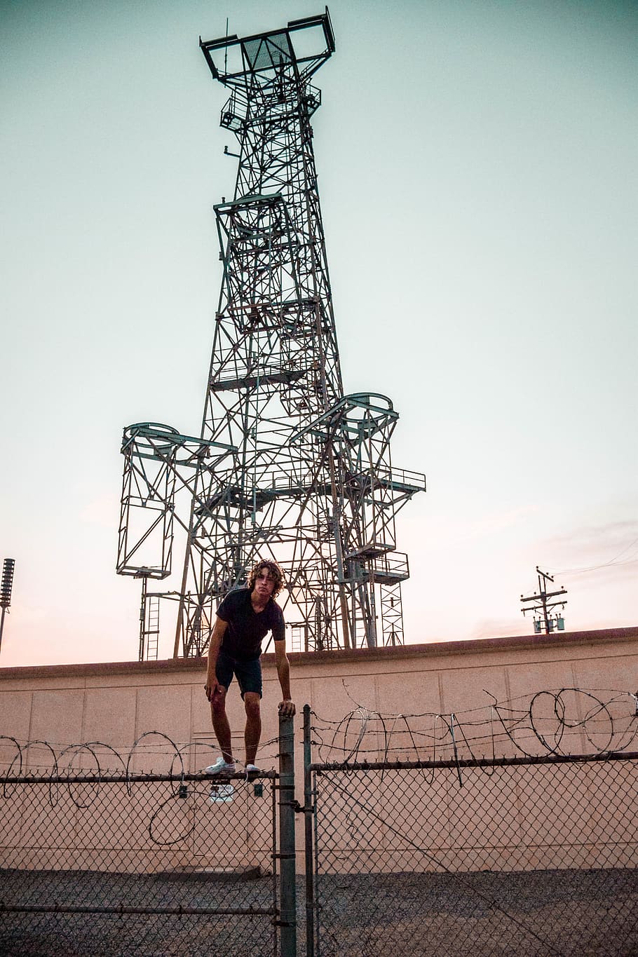 Person Standing on Steel Fence, barbed wire, connection, construction HD wallpaper