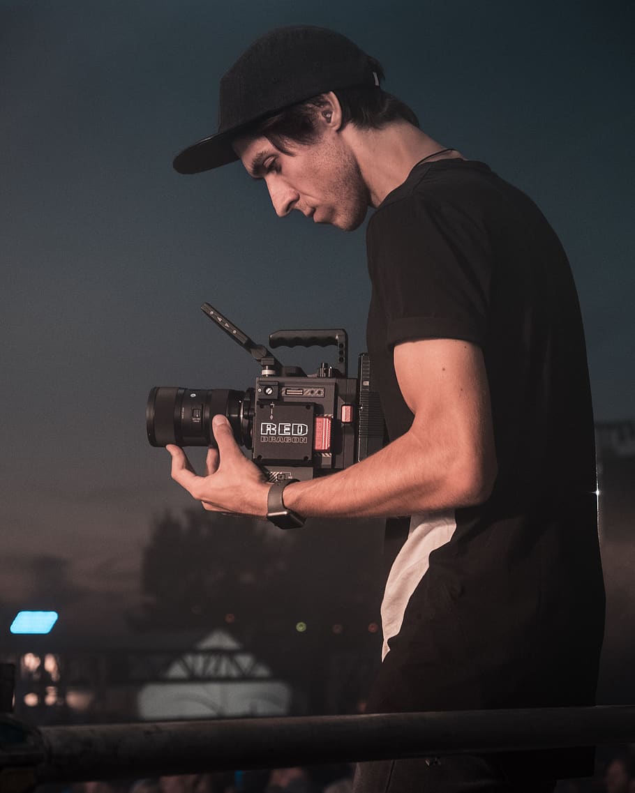 man holding video camera, person, human, people, electronics HD wallpaper