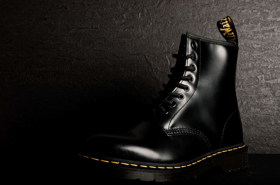 unpaired black leather boot, apparel, clothing, shoe, footwear