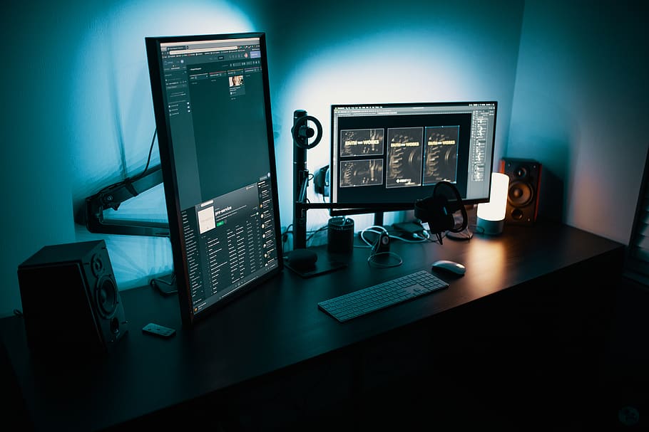 Image of a dual monitor setup with one monitor in a vertical orientation 