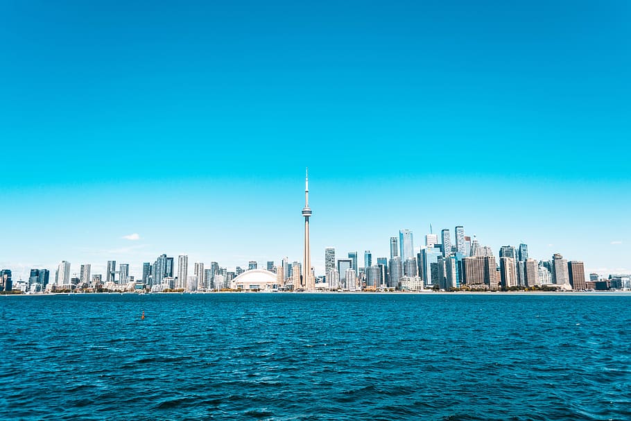 City Buildings Near Sea Under Blue Sky, architectural design HD wallpaper