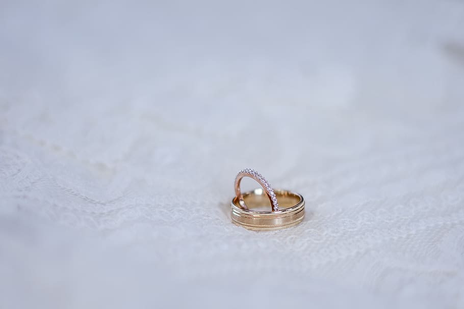 gold-colored ring on white surace, wedding ring, jewelry, love HD wallpaper