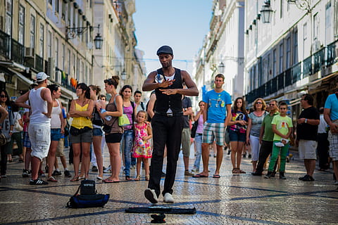 man surrounded by people, person, human, apparel, shorts, clothing HD wallpaper