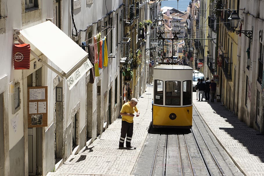 man standing beside cable cat, human, person, cable car, transportation HD wallpaper