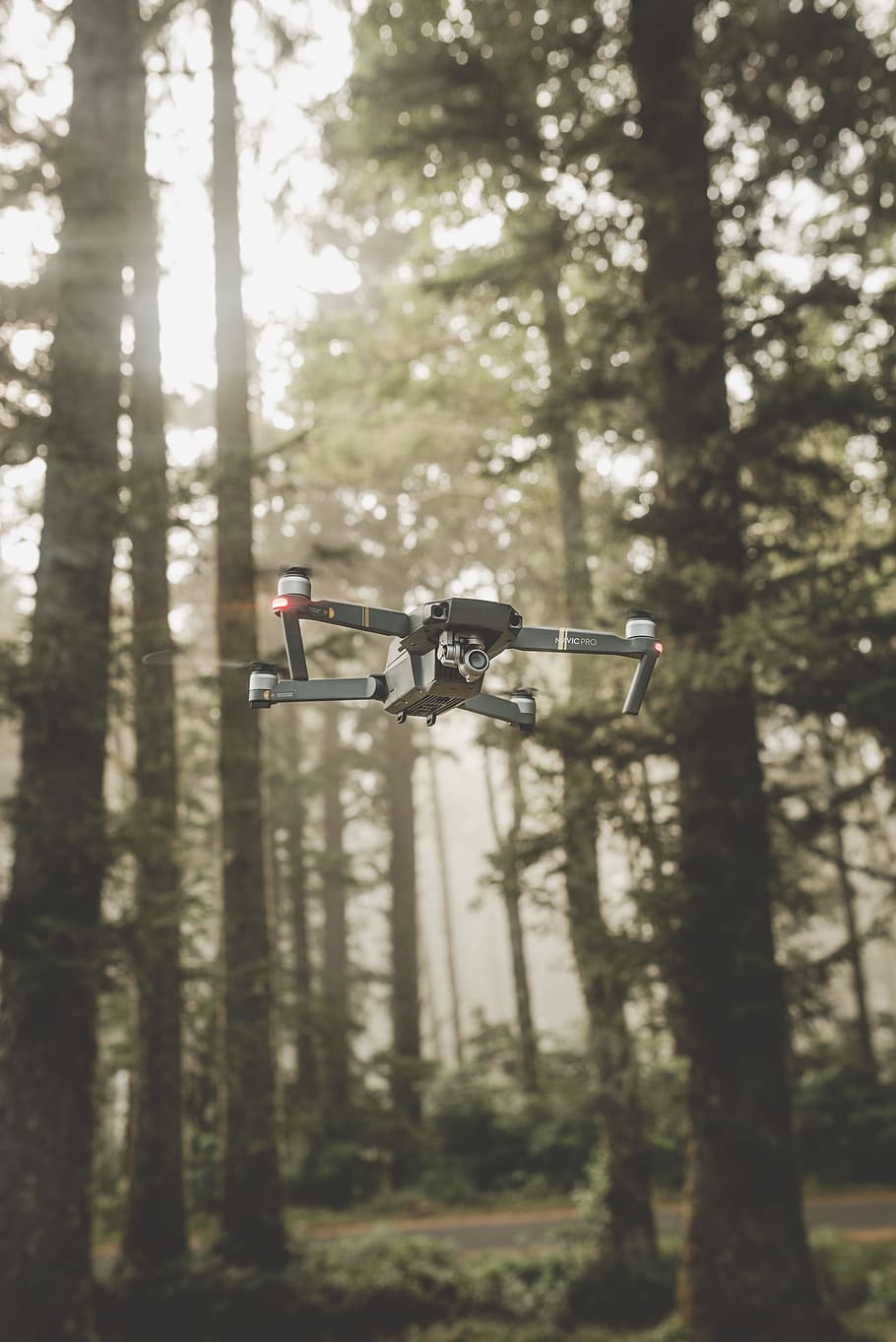 gray and black DJI Mavic Pro quadcopter drone on mid top air near forest at daytime, HD wallpaper