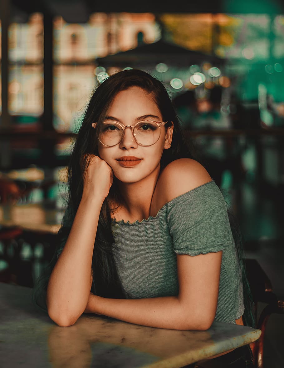 Woman Wearing Eyeglasses Sitting Beside Table, bar, beautiful