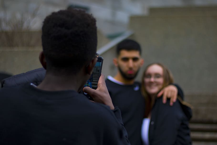 Man Taking Photo of Couple, blur, camera, college, diversity HD wallpaper