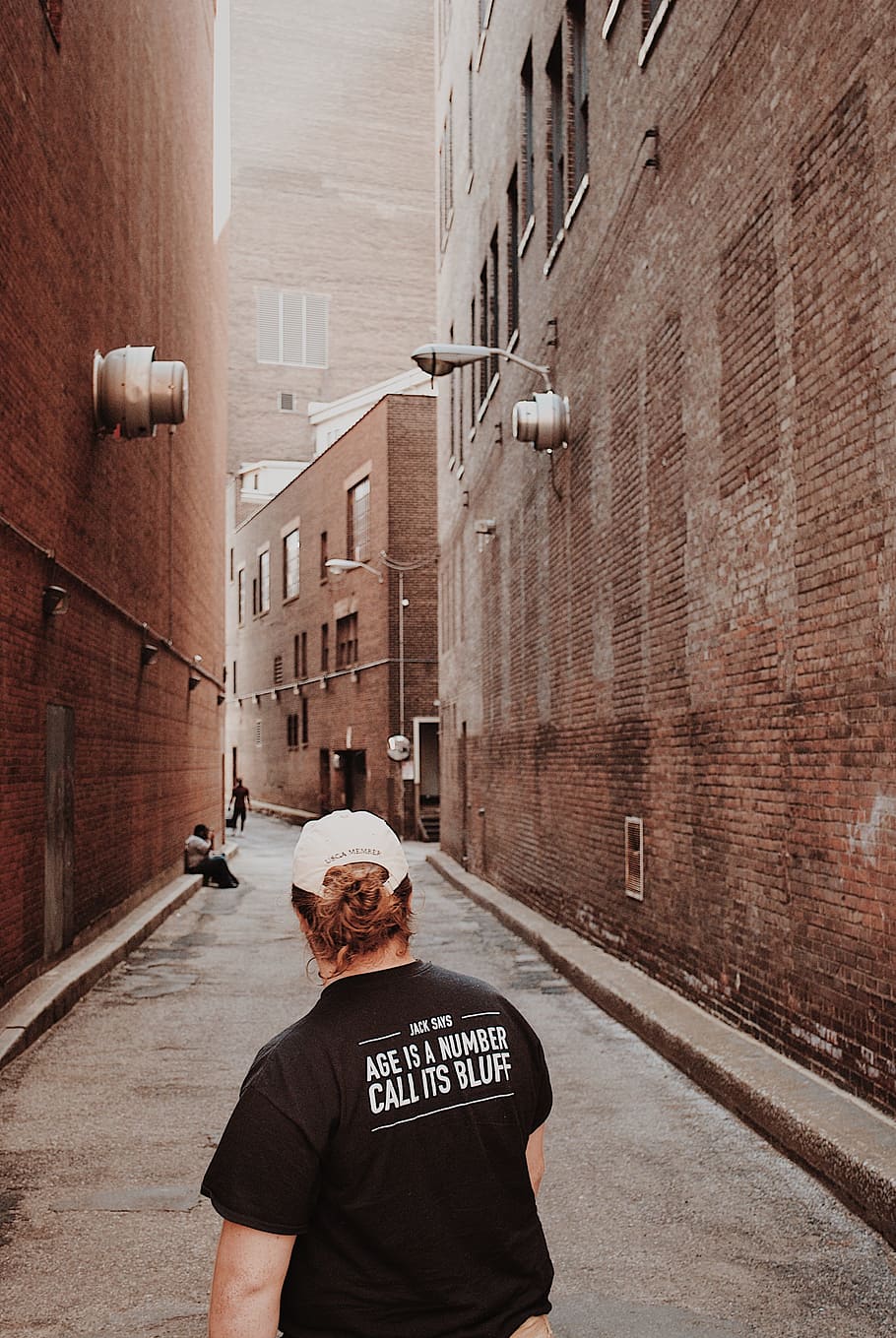 woman in black t-shirt, person, alley, street, design, t-shirt design
