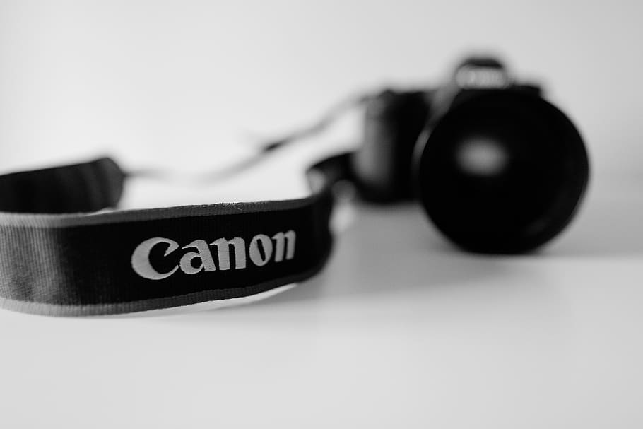 black Canon DSLR camera in grayscale photo, strap, accessories, HD wallpaper
