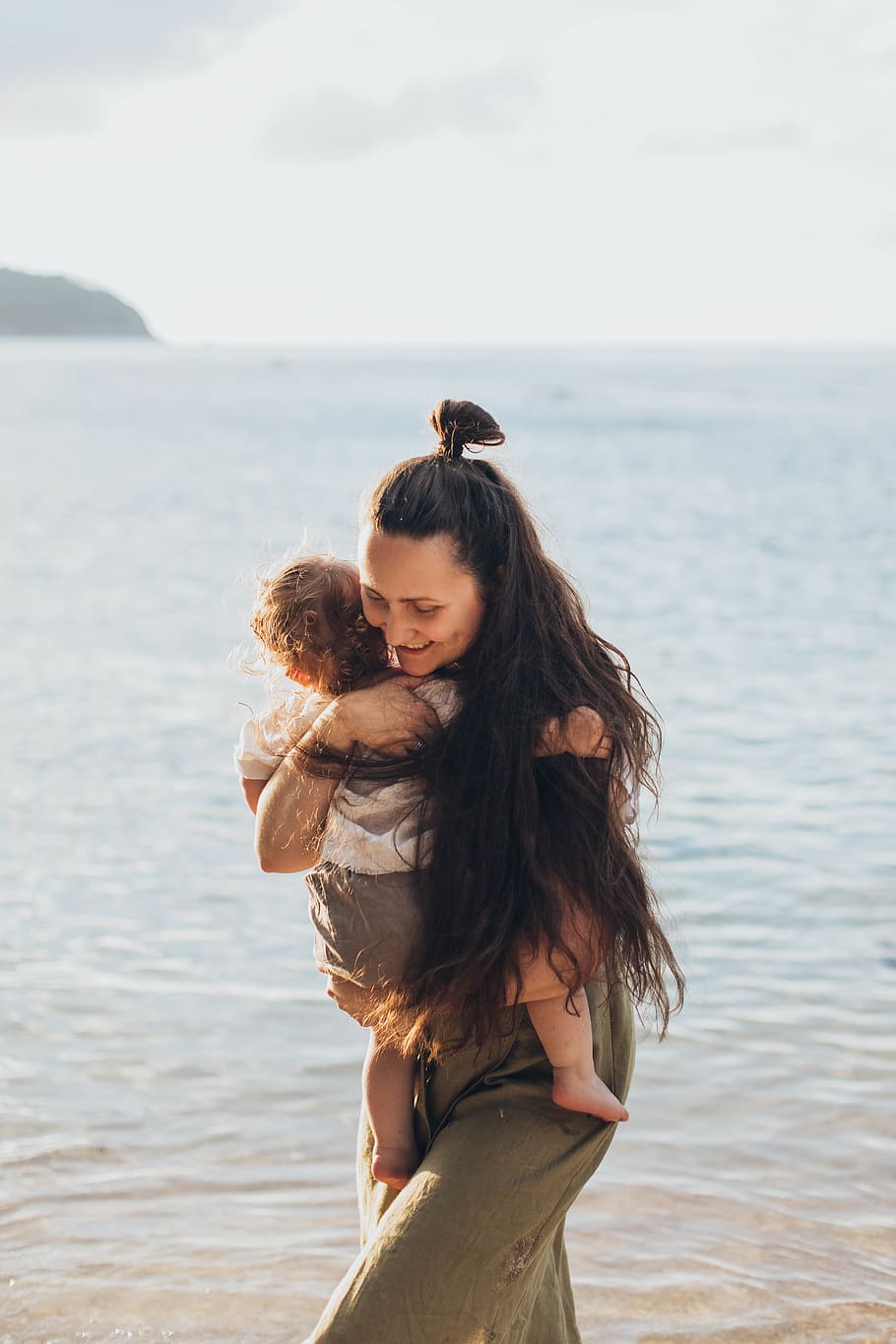 Woman Holding Baby, beach, boy, child, daylight, daytime, facial expression HD wallpaper